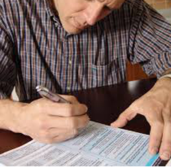 man filling out forms